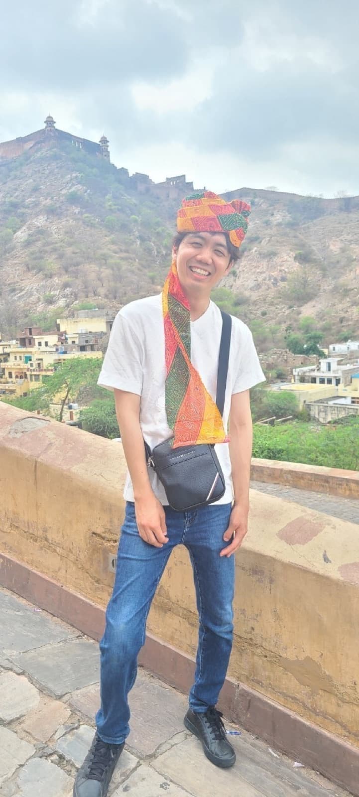 With a hillside fort in India behind me