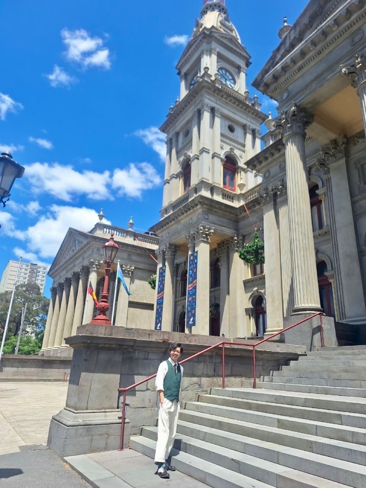 On the steps of an old town hall in Australia